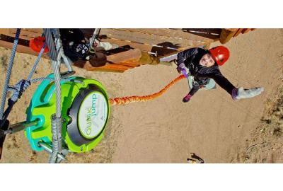 woman jumping off free fall device