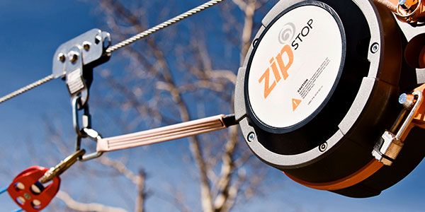 close up of zipSTOP Zip Line Brake with head rush zip line pulley for redirection lines