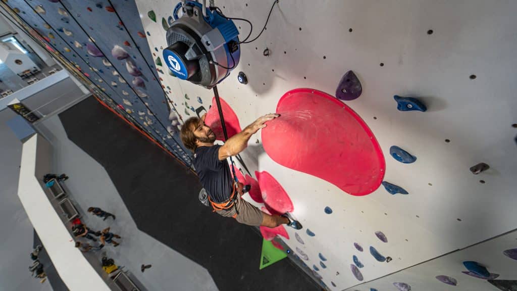 Pro climber and gym owner Chris Sharma tests out the revolutionary catch-and-hold technology of the TRUBLUE iQ+ Auto Belay.