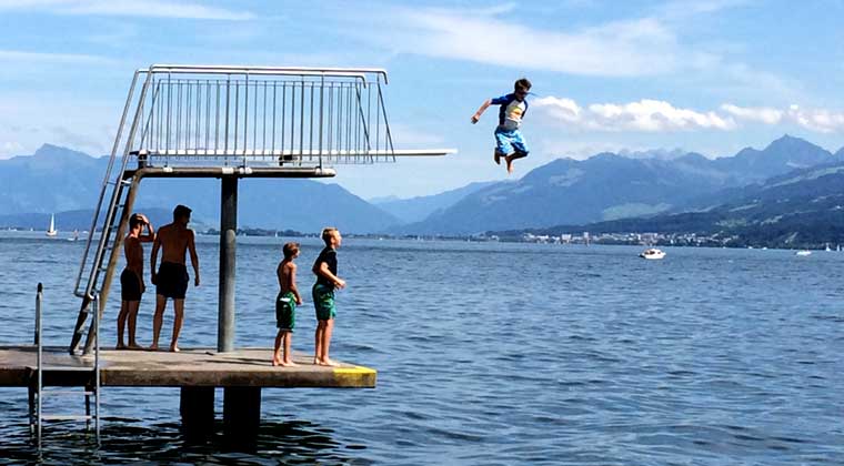 kid jumping of diving board