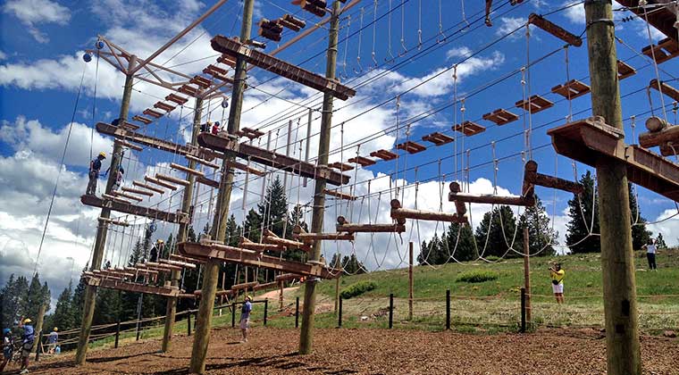 people on ropes course with trublue auto belay