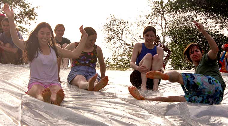 teens on a giant slip n slide